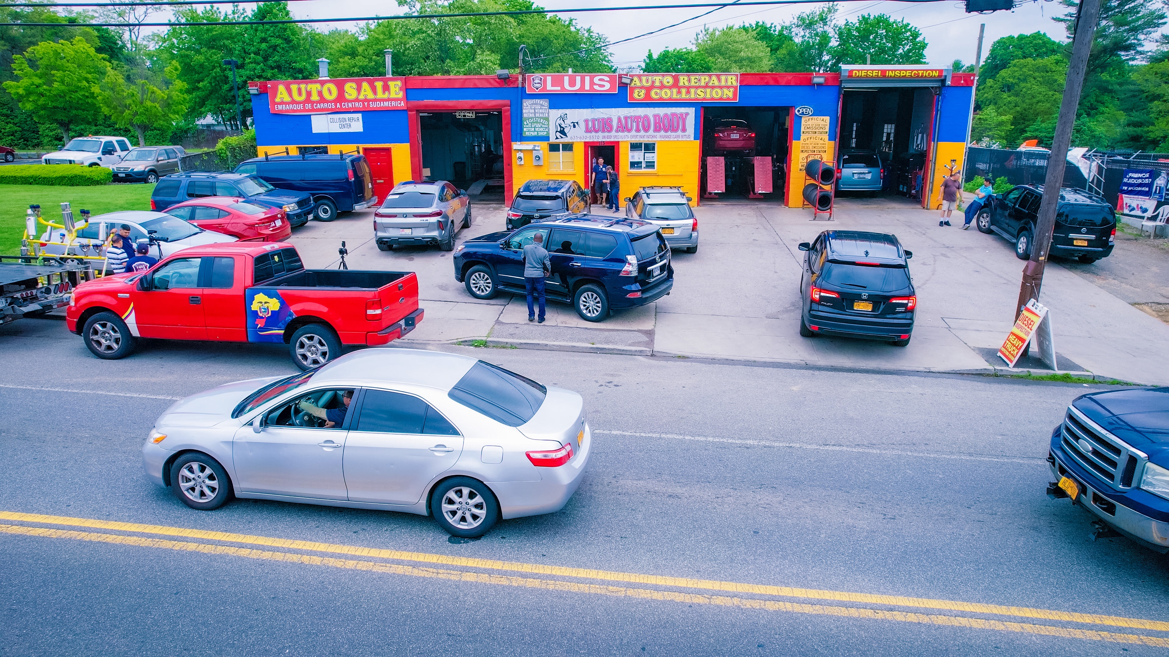 Cars parked outside the Luis Auto Repair shop on W Suffolk Ave